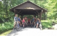 Group of bikers stopped on covered bridge