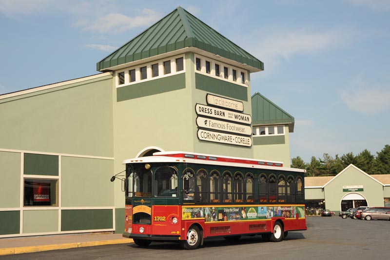 Trolley in front of outlet shopping