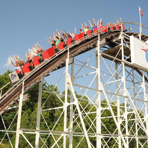 People riding the roller coaster called the "Comet" at the Great Escape Amusement Park