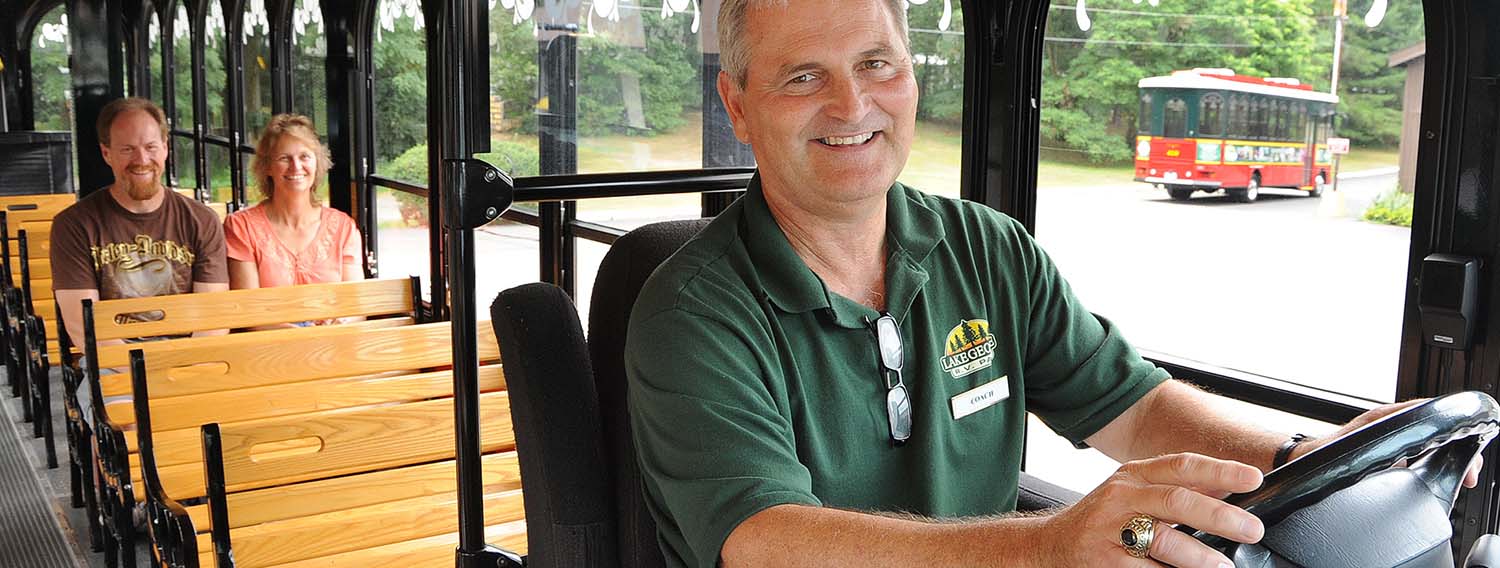 One of our trolley drivers, driving guests throughout park