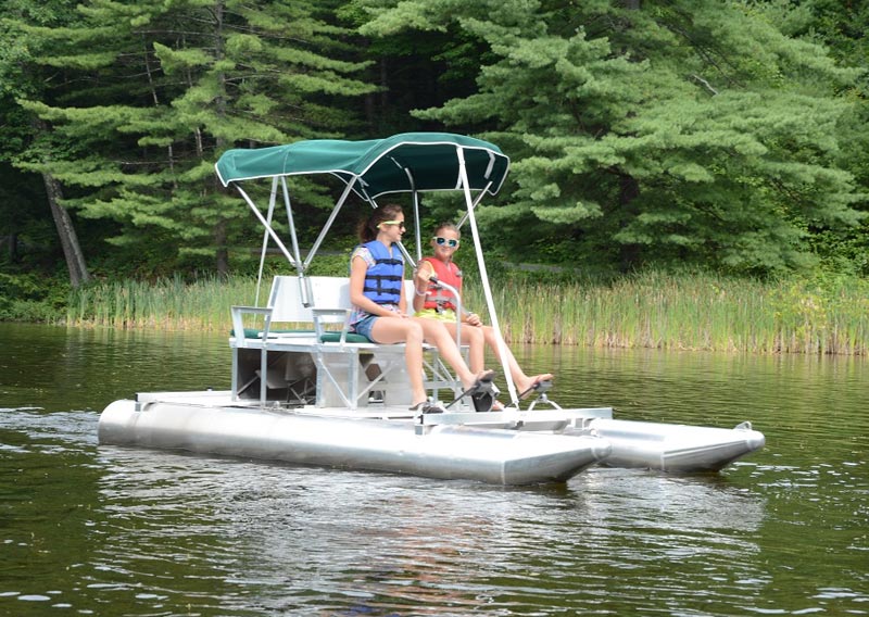 Guests on paddle boat in our paddleboat pond