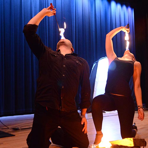 Performers at our French Mountain Playhouse breathing flames onto knives
