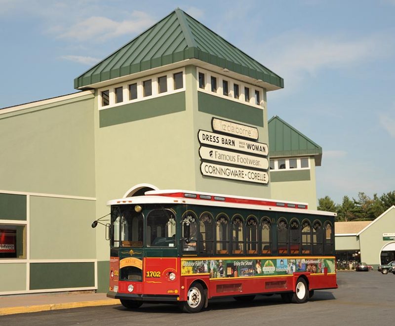 Trolley in front of shopping center