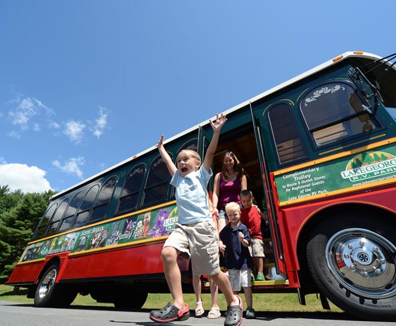 Kids and parents getting off of trolley