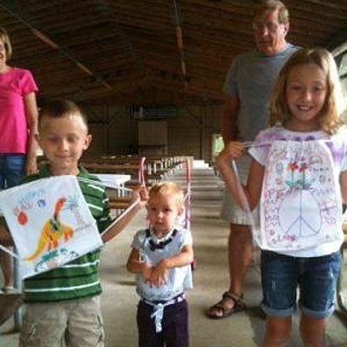 Children showing off their crafts