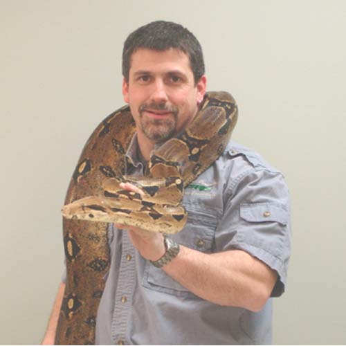 Man holding snake