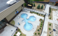 A birds eye view of Cascade Coves hottub area. 3 tubs are shown surrounded by a landscape area.