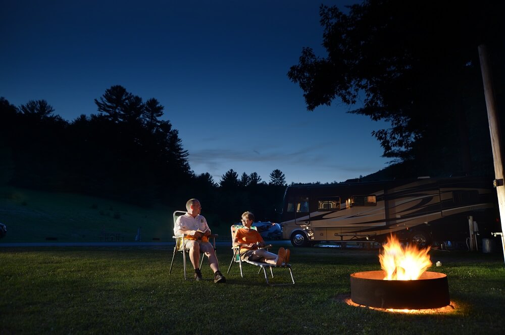 Couple sitting by fire