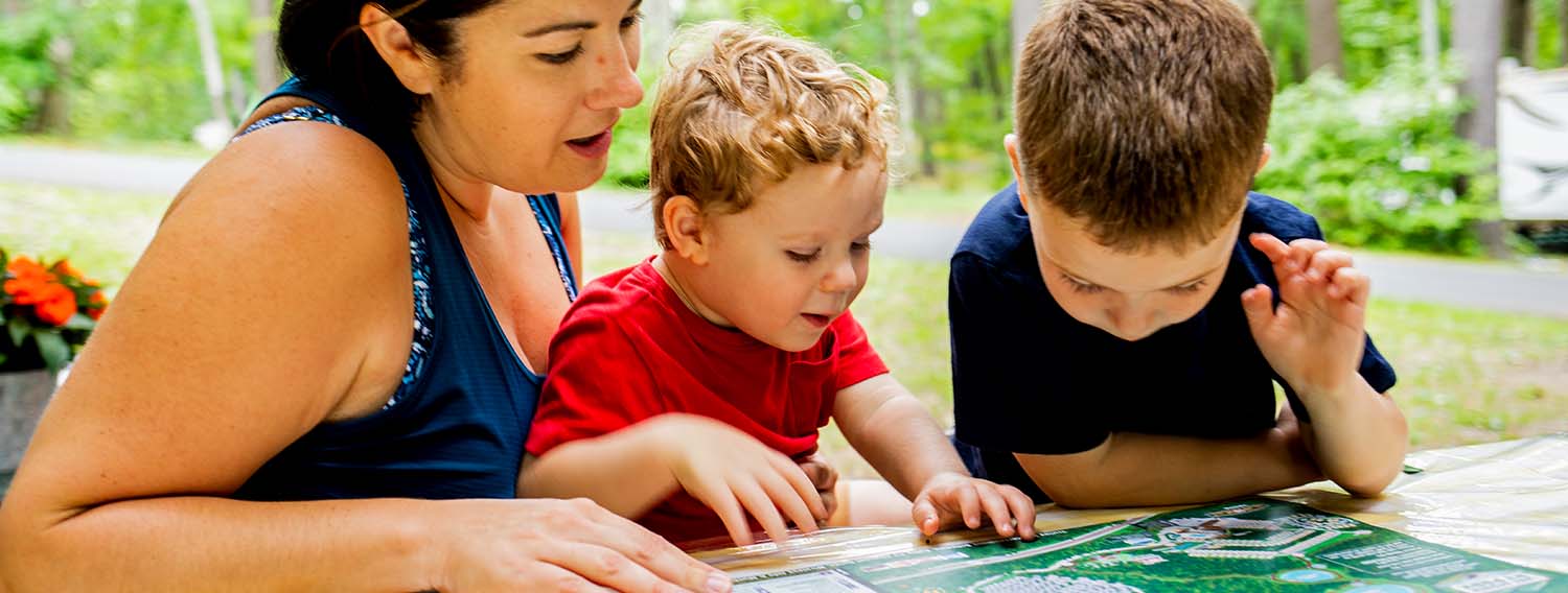 Mom with kids looking at map